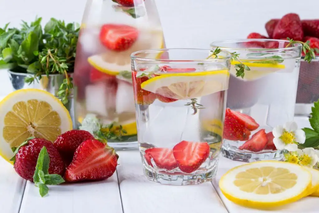 A refreshing glass of water infused with strawberries, lemons, and mint - the perfect drink for those with IBS.